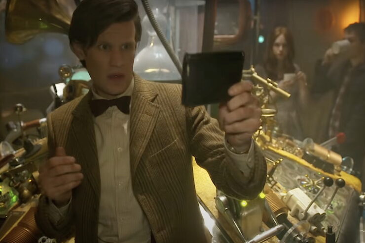 Matt Smith as The Doctor holding psychic paper